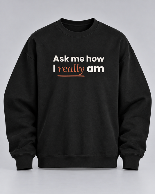 Sweatshirt „Ask me how I really am“ schwarz – Produktfoto (KI-generiert, Druck entspricht dem Original)