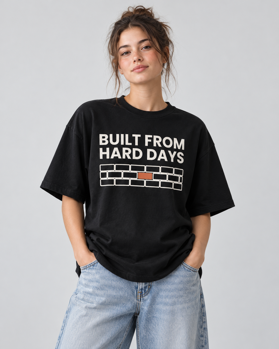 Damen T-Shirt „Built from hard days“ von ON2U am Modell (KI-generiert)